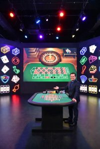 A live dealer studio designed with colorful, game-like visuals
